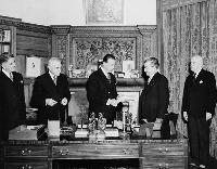 Viscount Alexander of Tunis (at centre), Governor General of Canada (1946-1952), receives the bill concerning the Terms of the Union of Newfoundland with Canada.  Date: 1949. Photographer: National Film Board of Canada. Reference: Library and Archives Canada, C-021401.